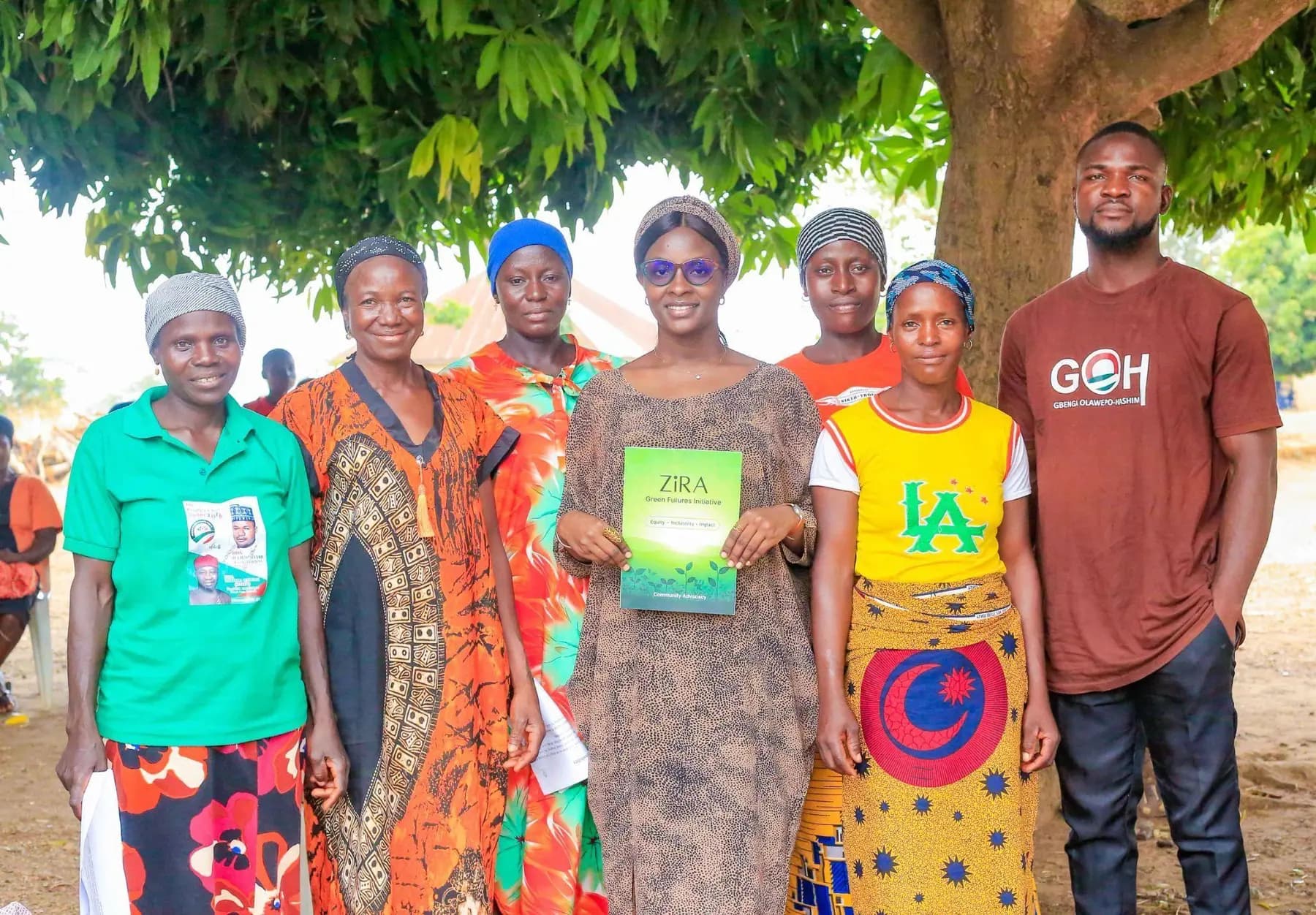 Piko Village participants holding ZiRA clean cooking materials