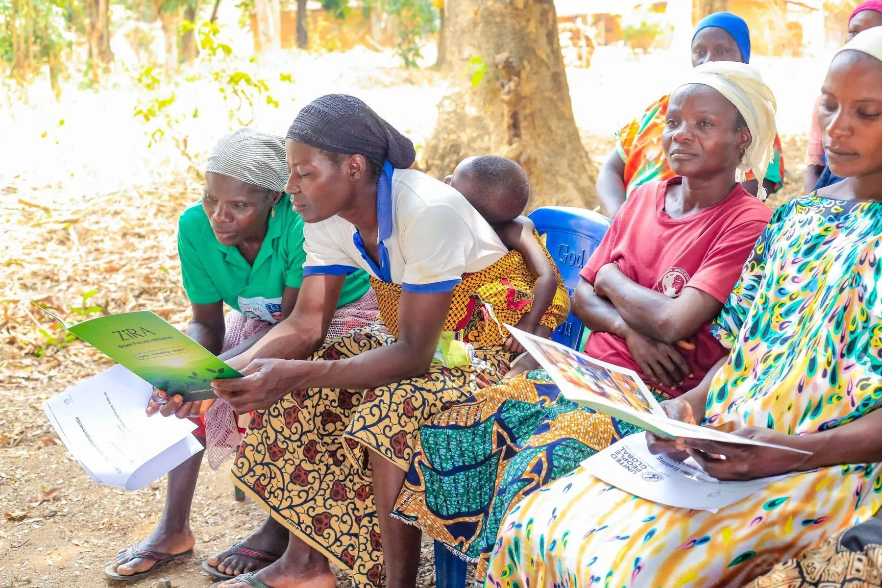 Piko Village women discussing clean cooking materials together