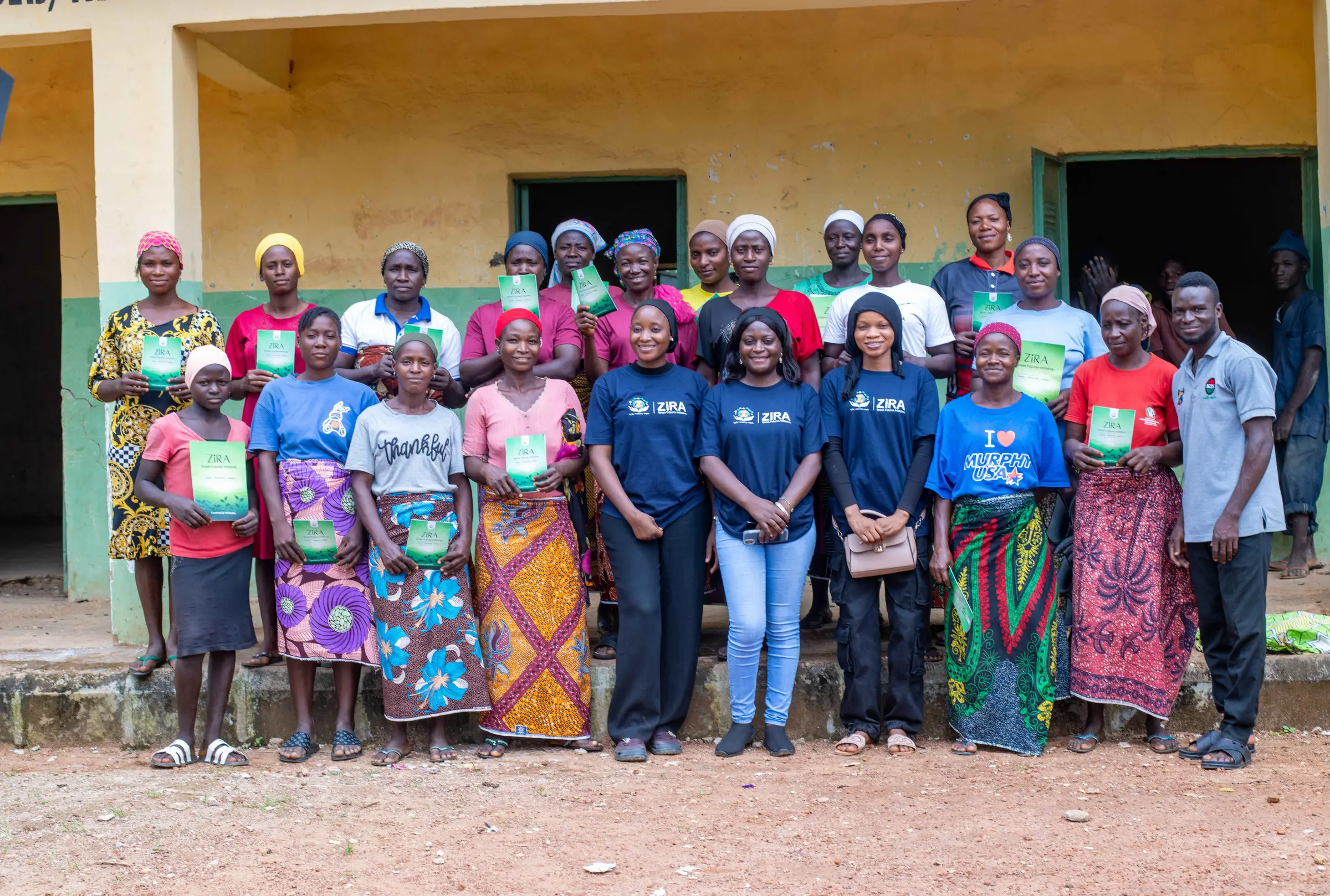ZiRA team and Piko Village community members gathered after the clean cooking demonstration
