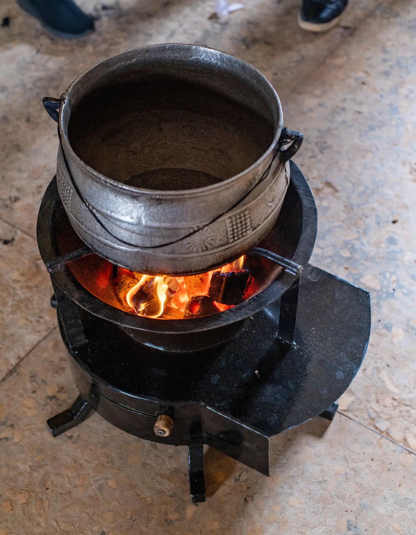 A pot cooking over the ZiRA clean cookstove